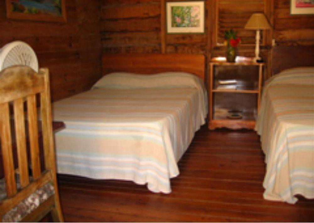 Secret Cabins At Firefly Beach Cottage Негрил Экстерьер фото